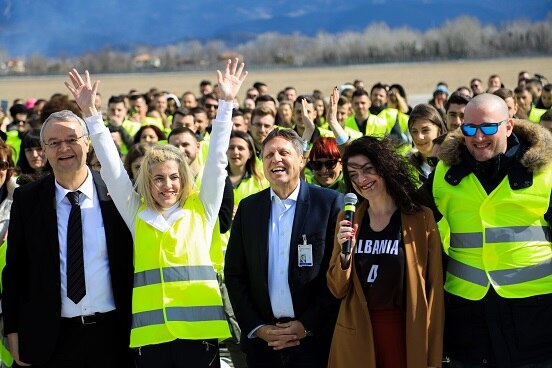 Swiss Ambassador Adrian Maître with the organisers of the 'Taken by Albania' campaign at Tirana International Airport.