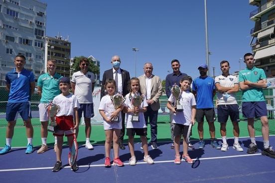 Swiss Ambassador Adrian Maître (fourth from left) with representatives from Tirana Municipality and Tirana Tennis Association after handing over winner's cups to four schools, part of an initiative to promote sports for health.