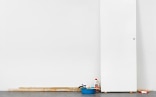 Untitled (Door with cleaning supplies)