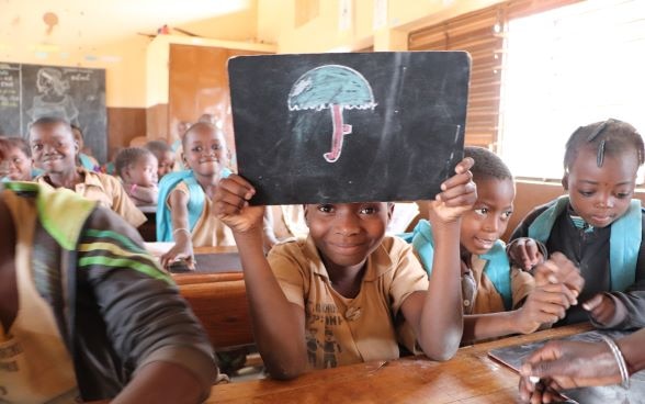 Les élèves d'une école accompagnée par le Programme d’Appui à la Qualité de l’Education (PAQUE) de la  Suisse au Bénin