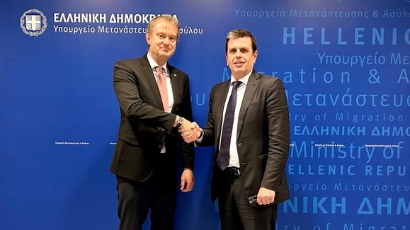 Ambassador Estermann and Minster Kairidis after the signature of the agreement.