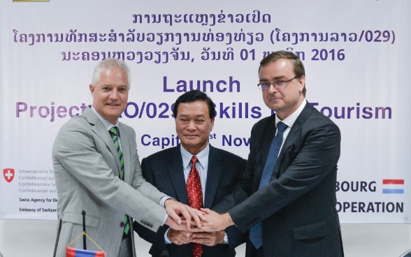 Dr Kongsy Sengmany, Vice Minister of Education and Sports, together with Mr Claude Jentgen, Chargé d’Affaires, Embassy of Luxembourg in Lao PDR, and Mr Tim Enderlin, Mekong Regional Director, Swiss Agency for Development and Cooperation (SDC) at the Skill for Tourism signing ceremony.  