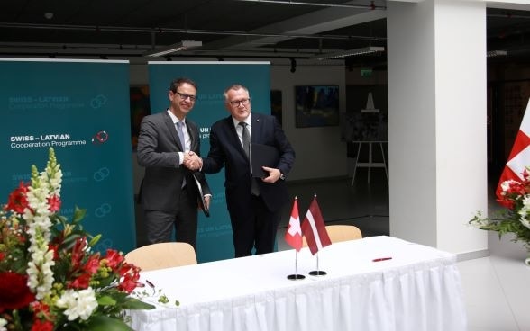 Zeremonie zur Unterzeichnung des Rahmenabkommens in Lettland 