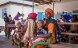 Women with their babies wait at the Hombolo Health Centre in Dodoma
