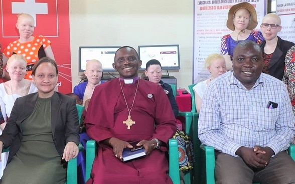 Handing over ceremony of laptops at the Center for Girls with Albinism in Shinyanga Region, Tanzania. From L – R (front row): Anna Holmström, Child Rights Advisor Eastern and Southern Africa - Felm; Bishop Dr. Emmanuel Makala, first bishop of the new Southeast of Lake Victoria Diocese; and Rev. Dr. Yohana Nzelu, Assistant to the Bishop for the Diocese 