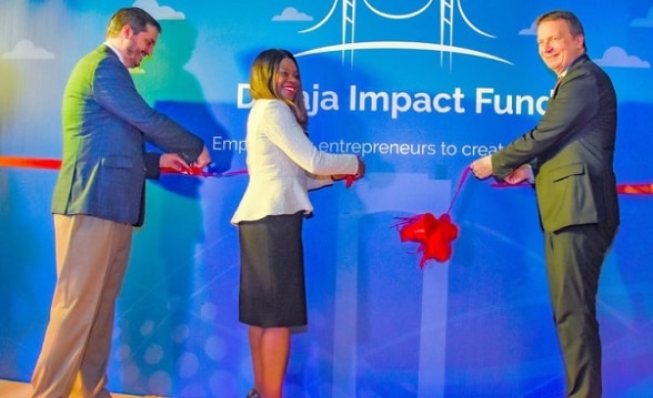 Ambassador Chassot (right), Alpha Mundi Foundation Executive Director, Ladé Araba (centre) and the SEAF Director of International Programmes Peter Righi (left) cut the ribbon to mark the launch of the Daraja Impact Fund in Dar es Salaam.