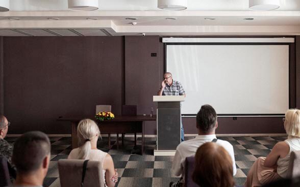 A speaker addressing an audience.