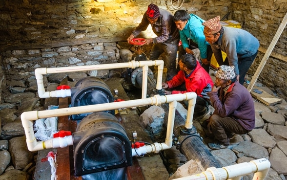 A local community is trained in the use of a micro power plant.