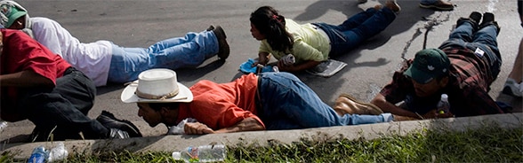 Supporters of the deposed president José Manuel Zelaya coming under fire from the Honduran army in 2009