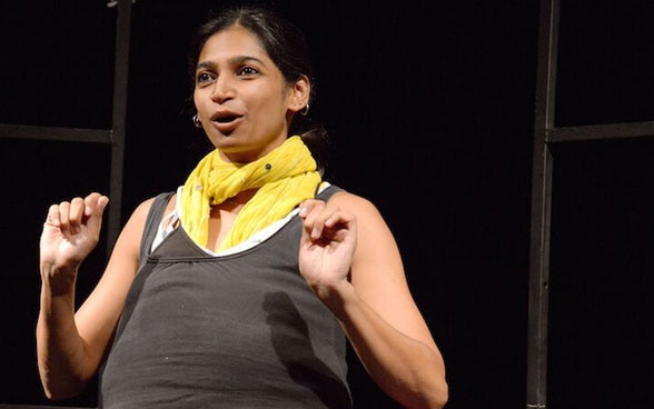 An Indian artist on stage during a theatre performance