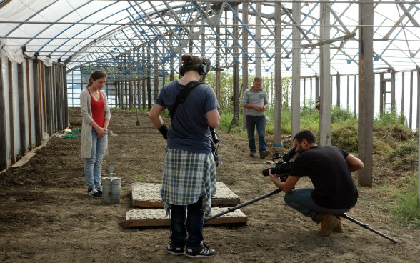 The photo shows preparations for the scene in which Medea waters tomato seedlings.