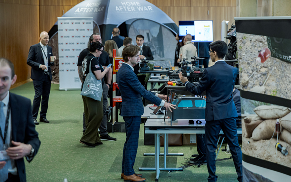 Conference participants learn about new technologies related to demining.