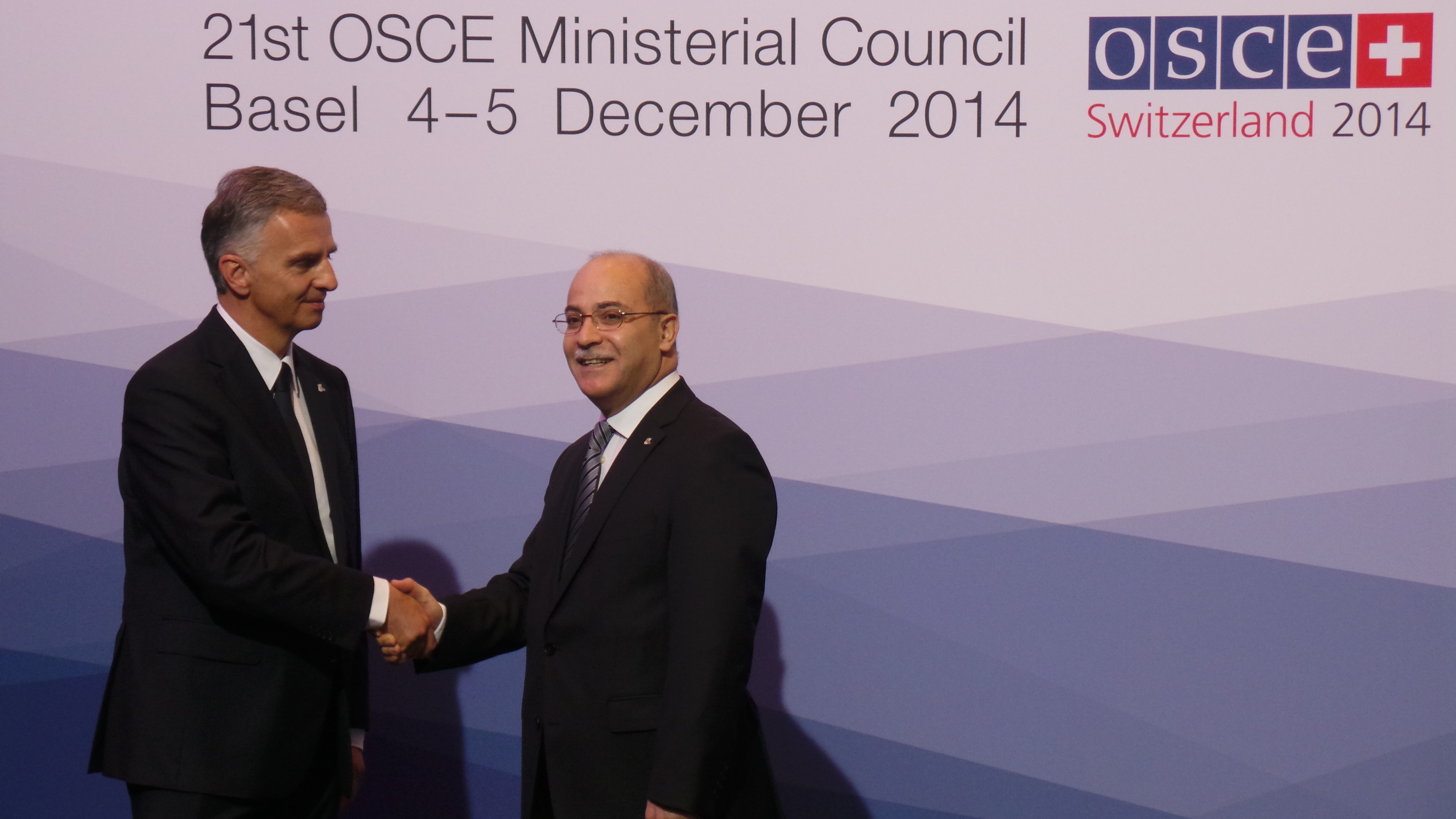 The President of the Swiss Confederation, Didier Burkhalter, greets Hussam Al Husseini, Permanent Representative to the OSCE in Jordan at the OSCE Ministerial Council 2014 in Basel