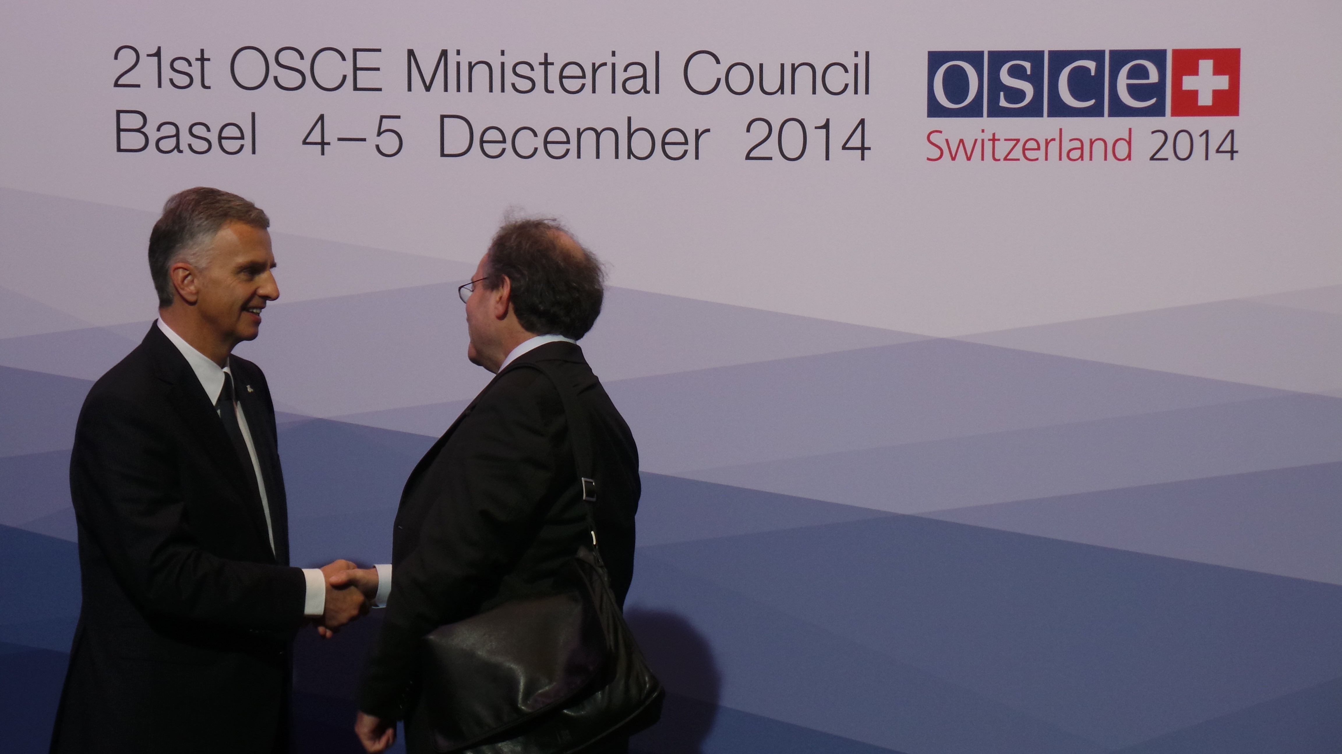 The President of the Swiss Confederation, Didier Burkhalter, greets Vincent Cochetel, Director of the Europe Bureau at the United Nations High commissioner For Refugees (UNHCR) at the OSCE Ministerial Council 2014 in Basel