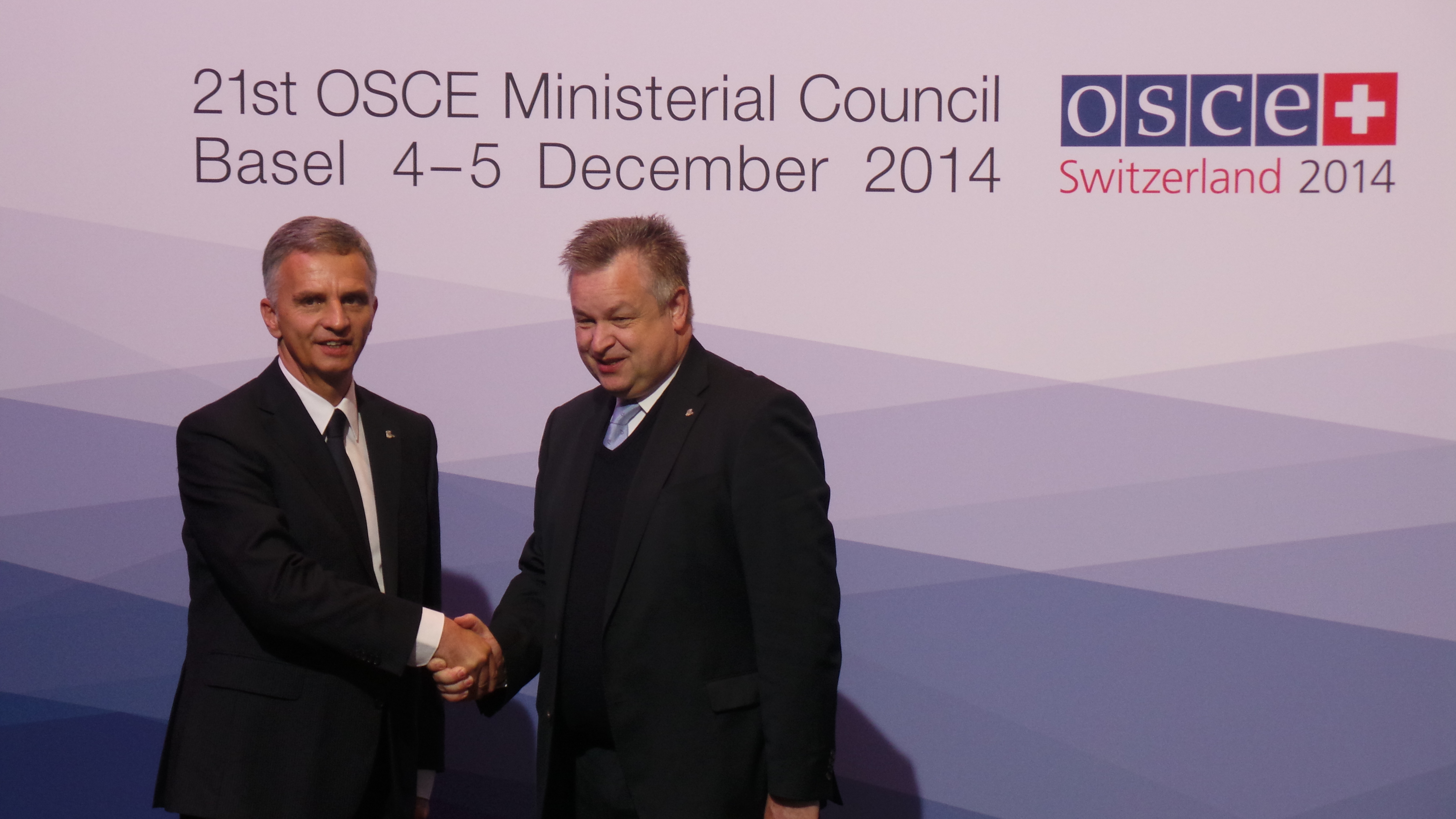 The President of the Swiss Confederation, Didier Burkhalter, greets Michael Georg Link, Director of the office for Democratic Insititutions and Human Rights (ODIHR) at the OSCE Ministerial Council 2014 in Basel