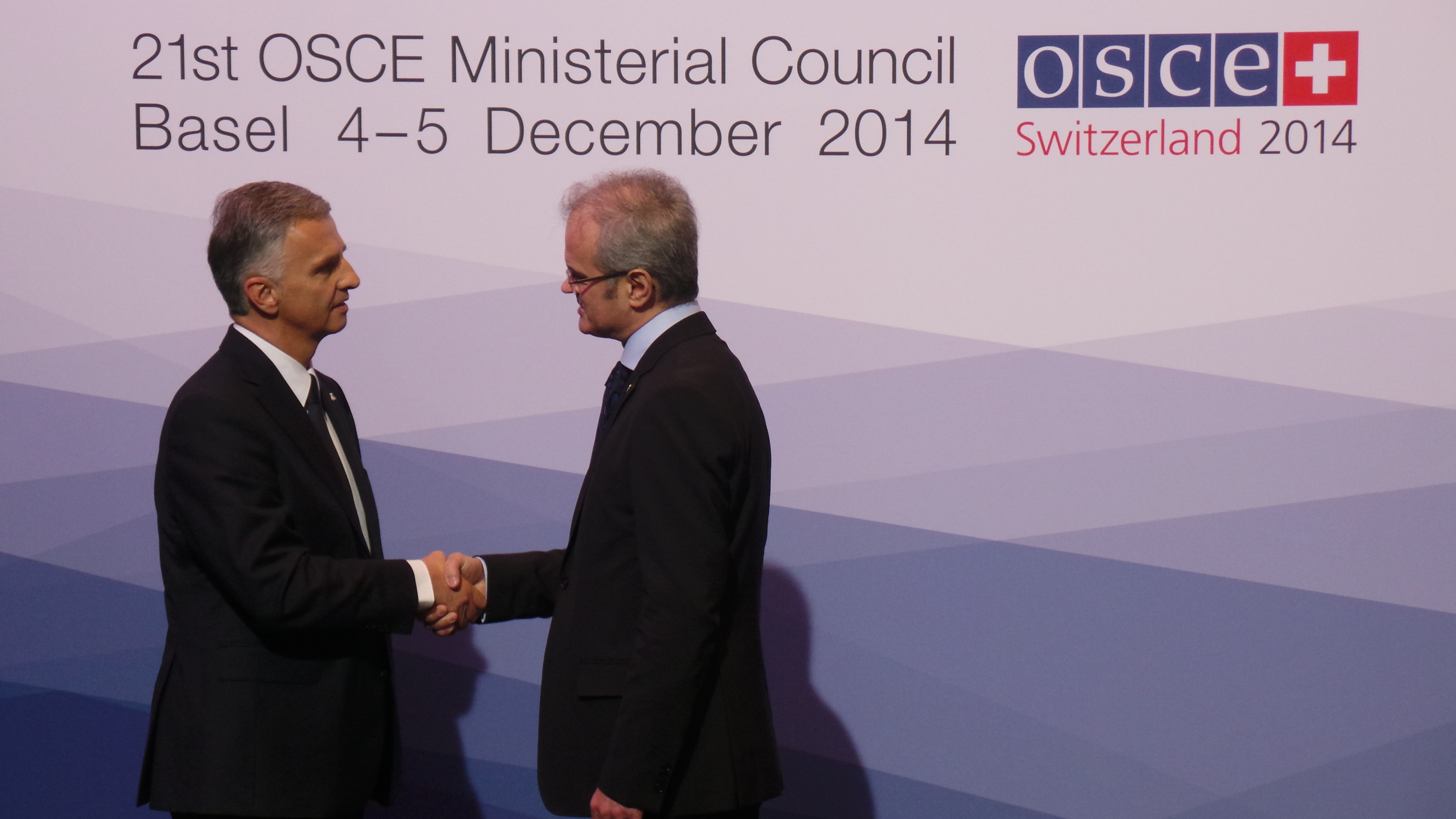 The President of the Swiss Confederation, Didier Burkhalter, greets Calin Stoica, Head of NATO and Multicultural and Political Affairs at the OSCE Ministerial Council 2014 in Basel