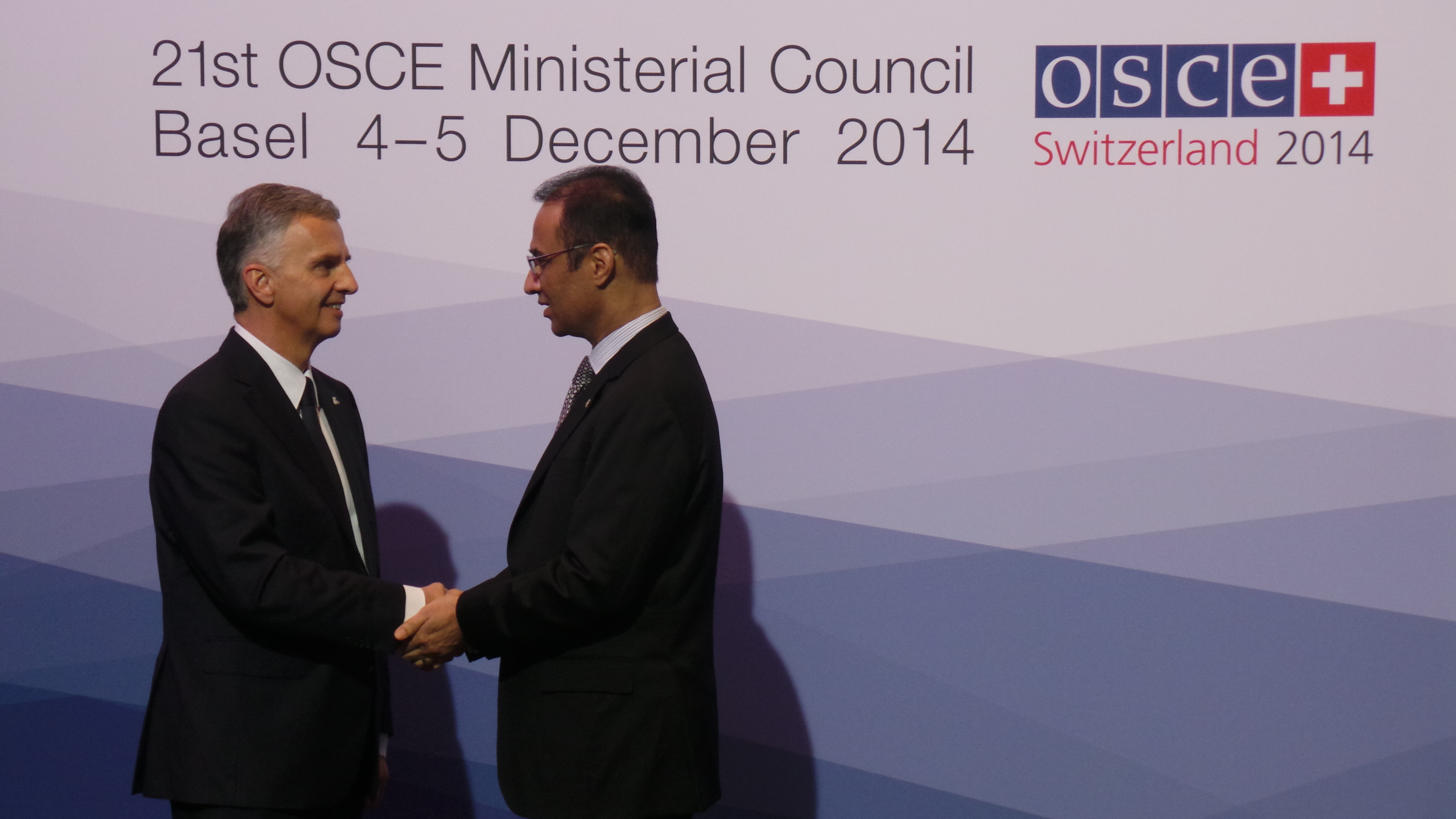 The President of the Swiss Confederation, Didier Burkhalter, greets Ayoob Erfani, permanent Representative to the OSCE in Afghanistan at the OSCE Ministerial Council 2014 in Basel.