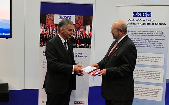 Didier Burkhalter, Chairperson-in-Office of the OSCE 2014 and President of the Swiss Confederation solemnly hands over the Commemorative Publication to Lamberto Zannier, OSCE Secretary General