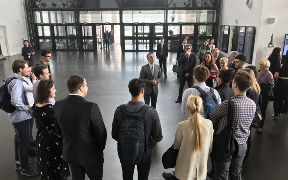 Talking with Swiss students in the entrance hall of Tsinghua University.  