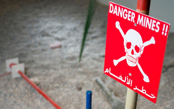 A warning sign for dangerous regions where mines are suspected
