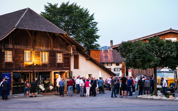 Swiss ambassadors talking to the local population.