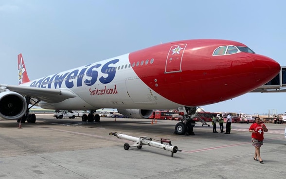 The Edelweiss Boeing is being prepared on the taxiway at Goa airport shortly before take-off. 