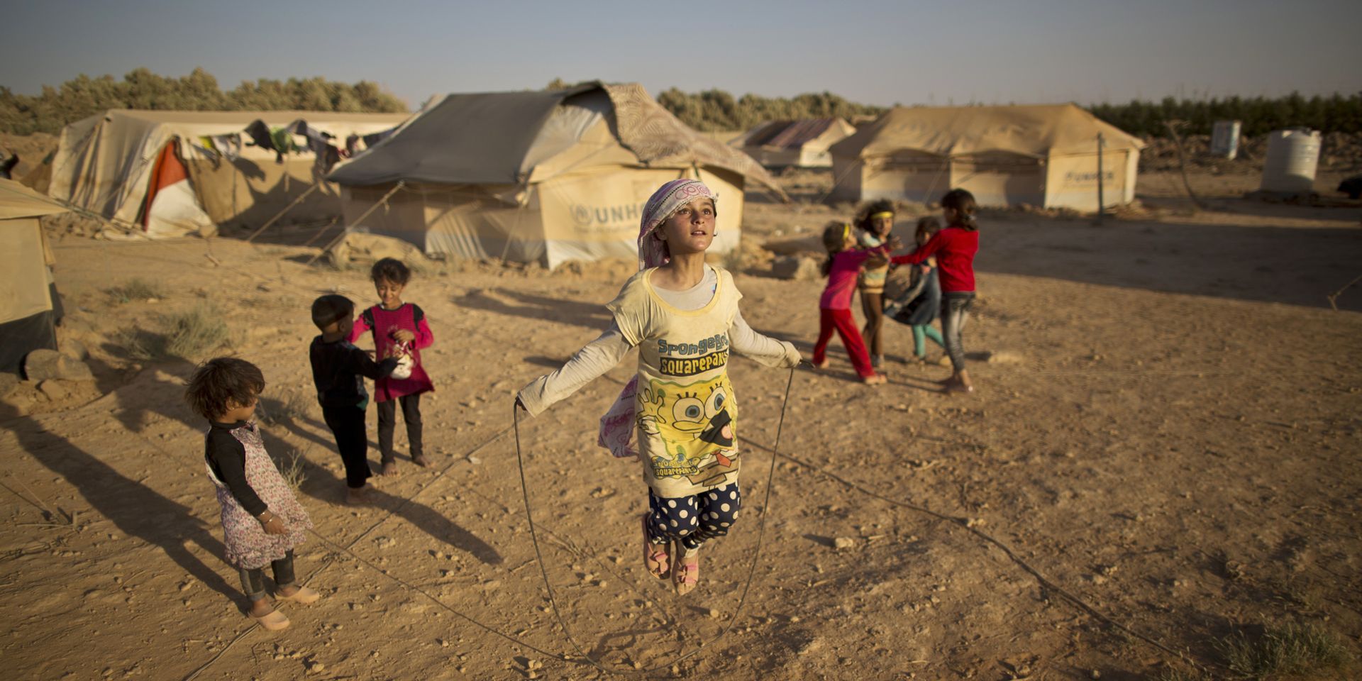 Children playing in a refugee camp in Jordan.
