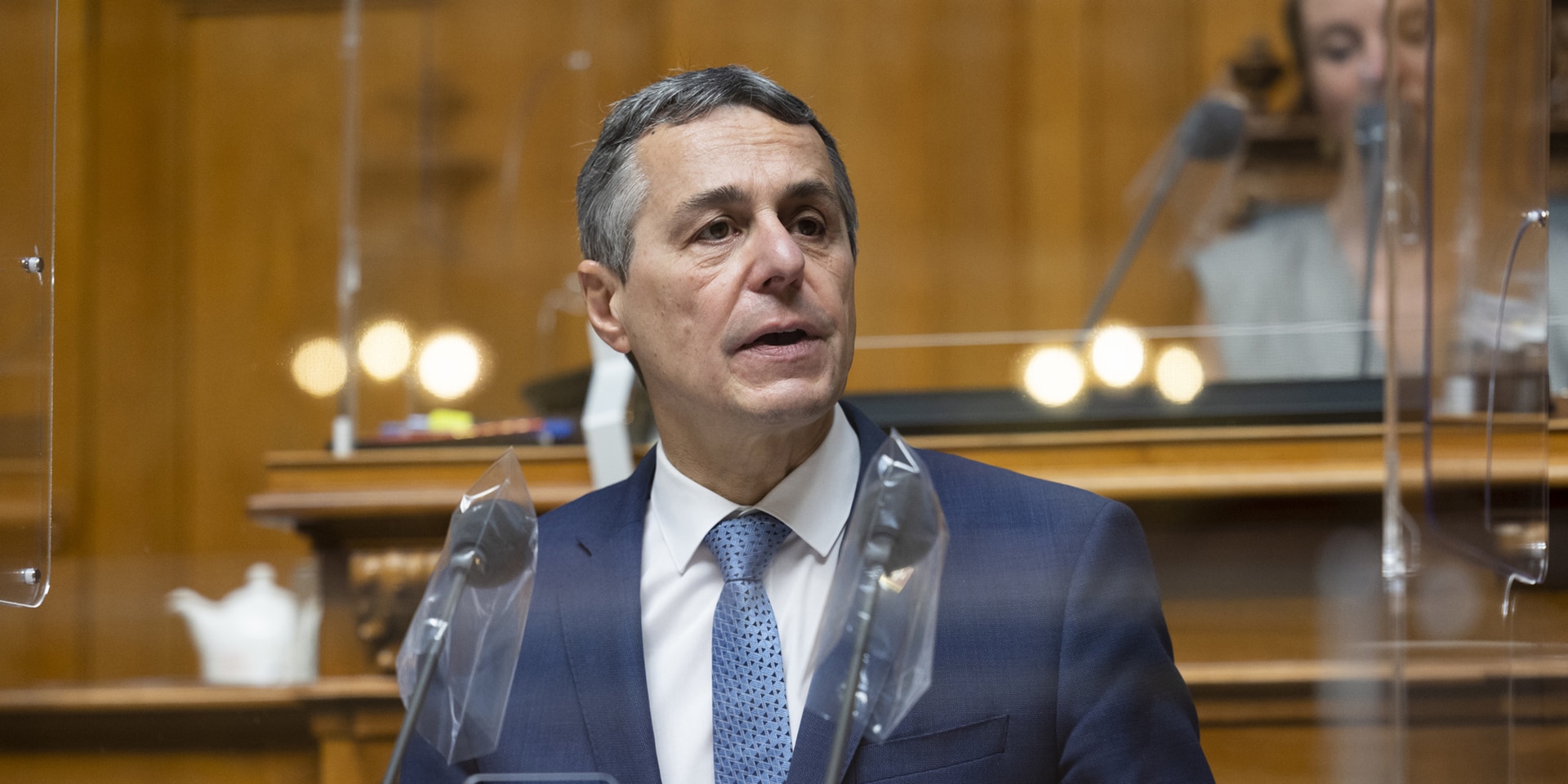 Ignazio Cassis stands at the podium to address the Federal Assembly after his election. 