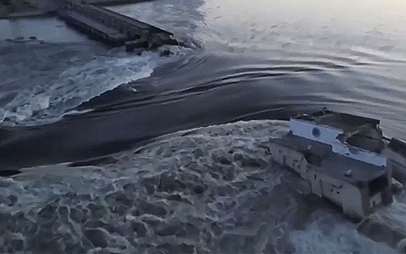 Huge masses of water flow through the breach in the Nova Kakhovka dam in Ukraine.