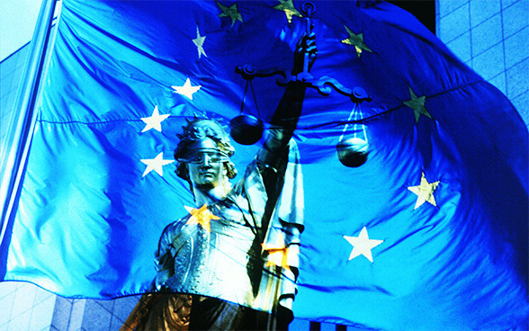 Image of the European flag and the statue of Justice