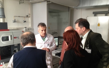 A discussion in a chemical laboratory. 
